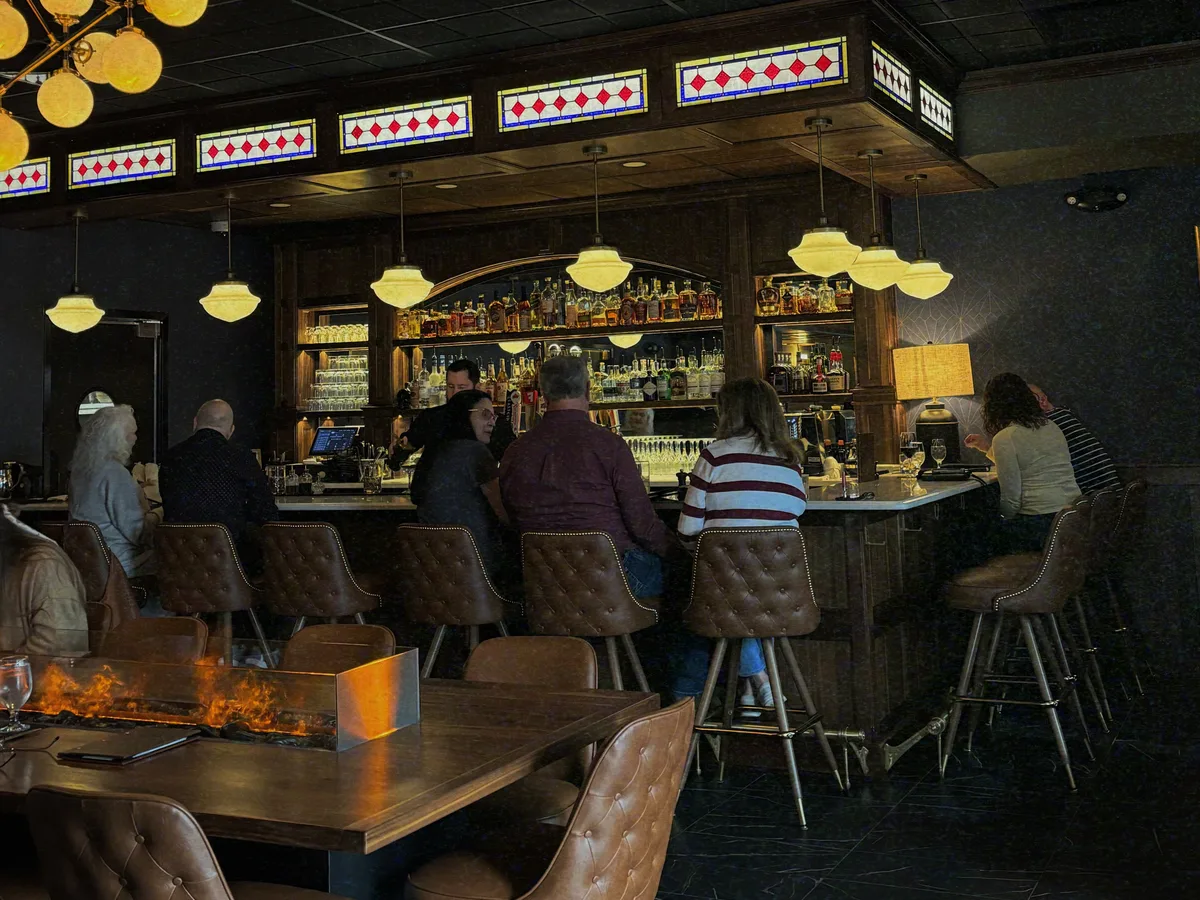 Guests seated at the Mercantile Chophouse bar